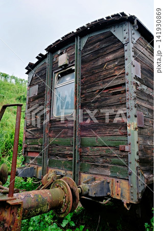 Close up of an old weathered wooden train car with rusty metal coupler Close up of an old weathered wooden train car with rusty metal coupler 141930869