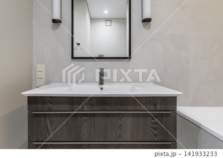 Modern Bathroom Vanity and Mirror Setup Close-Up Modern Bathroom Vanity and Mirror Setup Close-Up 141933233