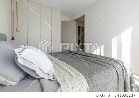 Modern Bedroom Interior with Wardrobe and Doorway View Modern Bedroom Interior with Wardrobe and Doorway View 141933237