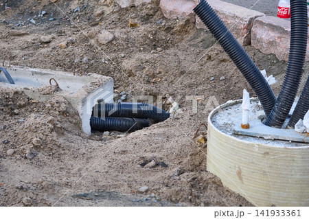 Electric.Concrete base for lighting pole with insulated cables 141933361
