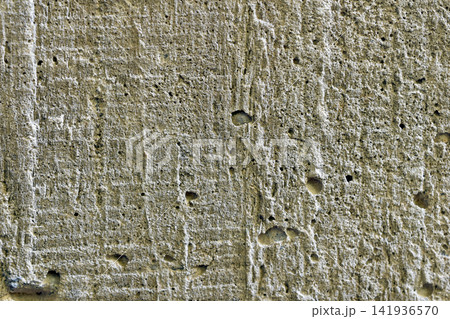 Close-up of rough concrete surface texture. Close-up of rough concrete surface texture. 141936570