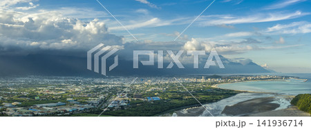 Aerial view of Hualien city, highlighting urban growth and Aerial view of Hualien city, highlighting urban growth and beautiful mountains and clouds Aerial view of Hualien city, highlighting urban growth and Aerial view of Hualien city, highlighting urban growth and beautiful mountains and clouds 141936714
