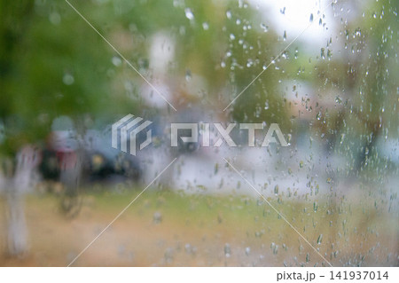 Rain drops on window glass. Abstract background texture. Weather forecast Antalya Turkey, Selective focus. High quality photo Rain drops on window glass. Abstract background texture. Weather forecast Antalya Turkey, Selective focus. High quality photo 141937014