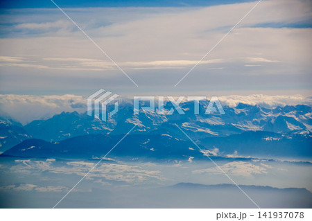 White passenger airplane flying in the sky amazing clouds in the background - Travel by air transport. High quality photo White passenger airplane flying in the sky amazing clouds in the background - Travel by air transport. High quality photo 141937078