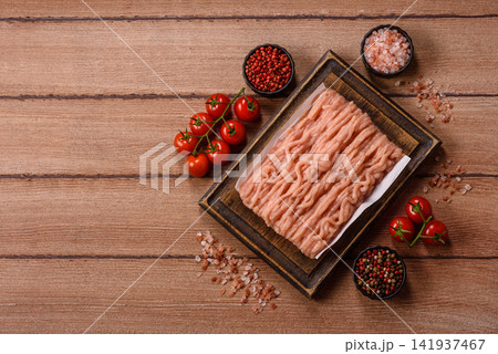 Fresh raw ground chicken, poultry meat for home cooking. Ground chicken Fresh raw ground chicken, poultry meat for home cooking. Ground chicken 141937467