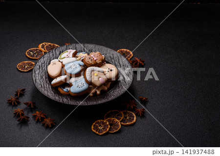 Gingerbread as a Christmas staple, sweet biscuits for the holiday. Gingerbread as a background Gingerbread as a Christmas staple, sweet biscuits for the holiday. Gingerbread as a background 141937488