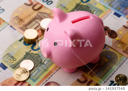 A piggy bank as a concept for storing, accumulating, and saving financial resources. A piggy bank A piggy bank as a concept for storing, accumulating, and saving financial resources. A piggy bank 141937548