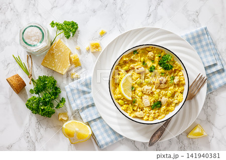 Chicken risotto with edamame beans, parsley, lemon Chicken risotto with edamame beans, parsley, lemon 141940381