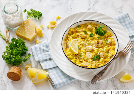 Creamy chicken and yellow rice bowl on a table Creamy chicken and yellow rice bowl on a table 141940384