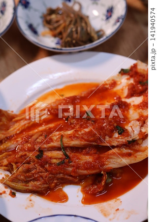 Fresh Kimchi on White Plate with Side Dishes Fresh Kimchi on White Plate with Side Dishes 141940574