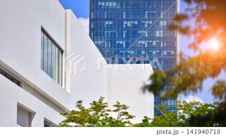 White concrete building wall against blue sky background, geometric exterior architecture. White concrete building wall against blue sky background, geometric exterior architecture. 141940718