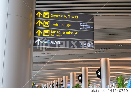 Changi Airport sign directing travelers to Skytrain, train to city, and bus services in Singapore Changi Airport sign directing travelers to Skytrain, train to city, and bus services in Singapore 141940730