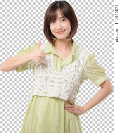Asian woman giving thumbs up while wearing green dress and white lace vest with confident friendly expression isolated on transparent background 141940875