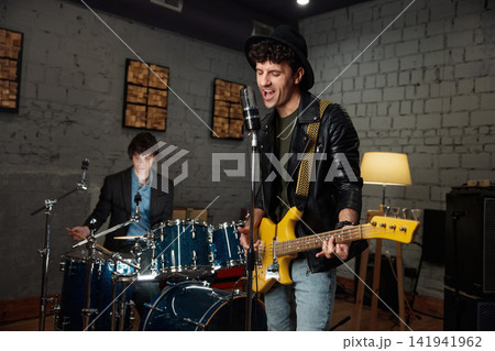 Cozy studio session capturing melodic riffs with talented band ensemble Cozy studio session capturing melodic riffs with talented band ensemble 141941962