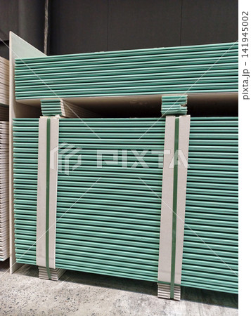 Blue gypsum plasterboards in the warehouse of the manufacturer 141945002