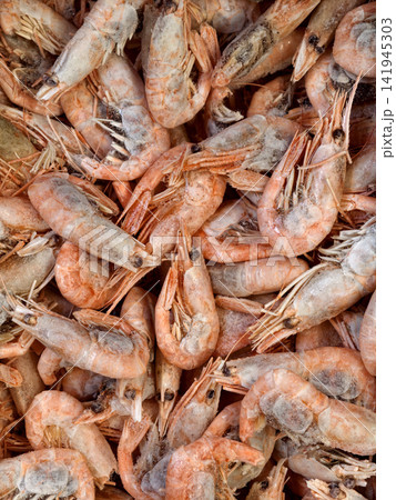 Fresh frozen red prawns displayed in supermarket freezer Fresh frozen red prawns displayed in supermarket freezer 141945303
