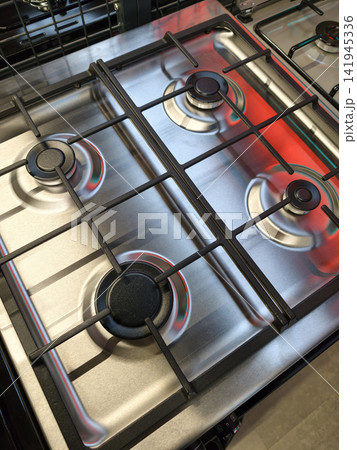 Overhead perspective of a gas stove with burners in a store Overhead perspective of a gas stove with burners in a store 141945336