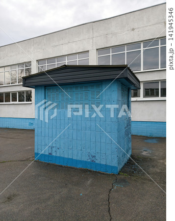 Concrete blue air circulation facility outside a Soviet era school, presenting a recognizable example of functional public architecture 141945346