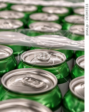 Green aluminum beer cans assembled in factory packaging highlighting beverage manufacturing efficiency and reliable commercial distribution for retail supply chains Green aluminum beer cans assembled in factory packaging highlighting beverage manufacturing efficiency and reliable commercial distribution for retail supply chains 141945518