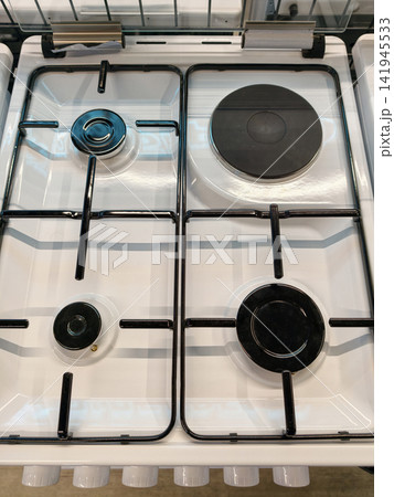 New white kitchen gas stove with four burners one electric from above in store New white kitchen gas stove with four burners one electric from above in store 141945533