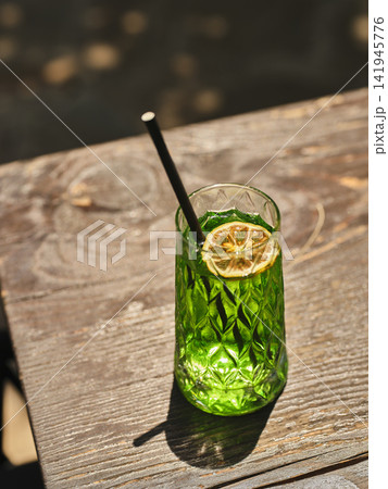 a delicious cocktail on a sunny day a delicious cocktail on a sunny day 141945776