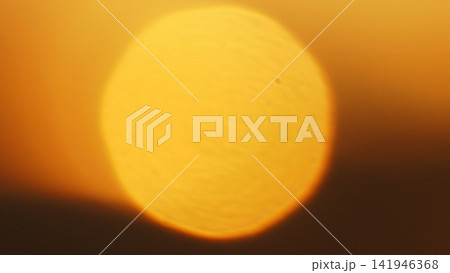 Solar Eclipse, Red Sky and Dramatic Clouds at Sunset 141946368