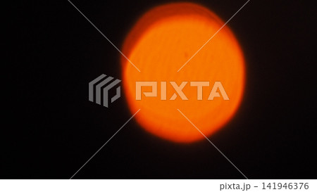 Solar Eclipse, Red Sky and Dramatic Clouds at Sunset 141946376