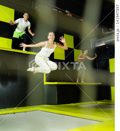 Woman sportswoman fitness jumping on club trampoline 141947897