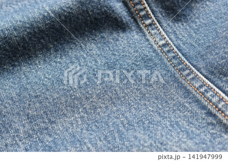 seam of blue denim texture background, jean fashion style seam of blue denim texture background, jean fashion style 141947999