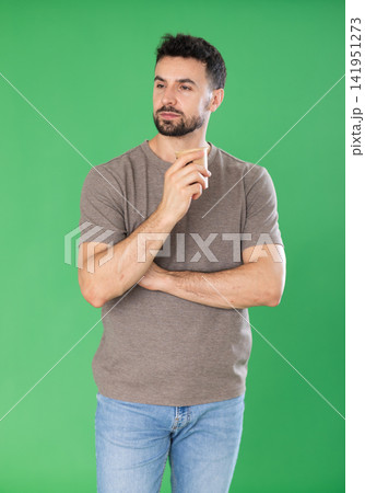Adult man drinking coffee in front of green screen Adult man drinking coffee in front of green screen 141951273