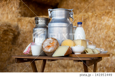Dairy products and milk cans in the hayloft Dairy products and milk cans in the hayloft 141951449