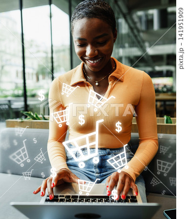 Online shopping with a woman at a cafe using a laptop and viewing shopping carts and dollar signs 141951909