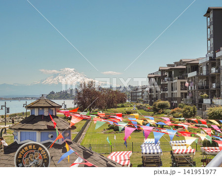 Mount Rainier volcano view over Point Ruston waterfront promenade with festival flags.- June 13, 2026 Ruston WA, USA 141951977