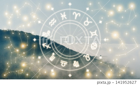 Astrology zodiac signs displayed on a cloudy mountain background during daylight Astrology zodiac signs displayed on a cloudy mountain background during daylight 141952627