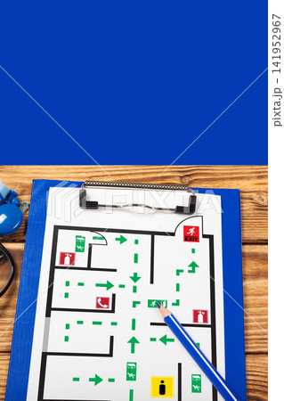 Emergency evacuation plan showing exit routes and safe areas for public spaces 141952967
