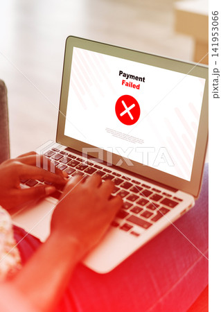 User experiences failed online payment on a laptop while sitting on a couch User experiences failed online payment on a laptop while sitting on a couch 141953066