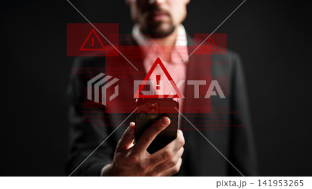 Man holds phone with emergency 911 alerts on screen in dark setting during late night hours 141953265