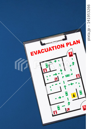 Emergency evacuation plan showing routes and exits in a building with emergency signs for safety Emergency evacuation plan showing routes and exits in a building with emergency signs for safety 141953266