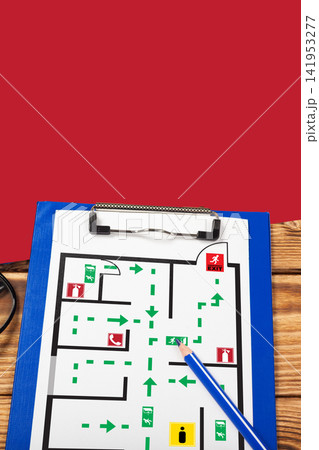 Emergency evacuation plan showing exit routes and safe areas for building occupants 141953277