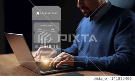 Person books a flight to Geneva from London using a laptop and prepares to download the boarding pass for the trip Person books a flight to Geneva from London using a laptop and prepares to download the boarding pass for the trip 141953499
