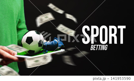 Sport betting on soccer with money and equipment in a dark setting Sport betting on soccer with money and equipment in a dark setting 141953590
