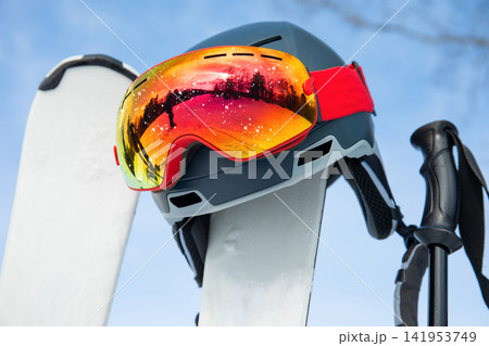 Ski gear lies on pristine snow ready for winter adventure Ski gear lies on pristine snow ready for winter adventure 141953749