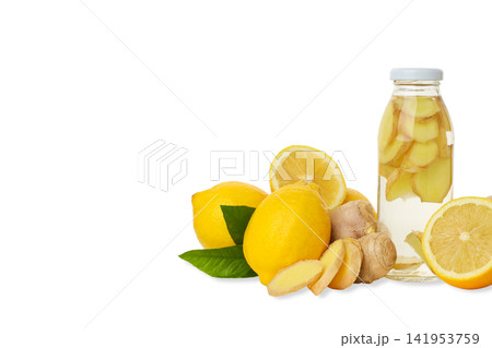Bottle with ginger and lemon next to whole lemons, isolated, PNG Bottle with ginger and lemon next to whole lemons, isolated, PNG 141953759