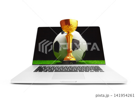 Sports betting on soccer matches with virtual trophy displayed on a laptop screen Sports betting on soccer matches with virtual trophy displayed on a laptop screen 141954261