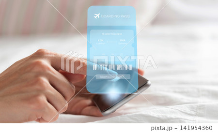 Travel booking for a flight from London to Geneva using a mobile device at home in the morning Travel booking for a flight from London to Geneva using a mobile device at home in the morning 141954360