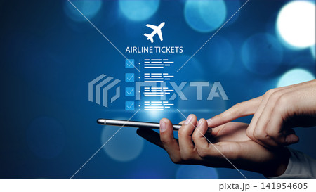 Finding and booking airline tickets using a phone to secure travel plans online for upcoming trips 141954605