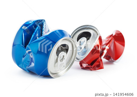 Crushed cans of blue and red soda placed on a white surface 141954606
