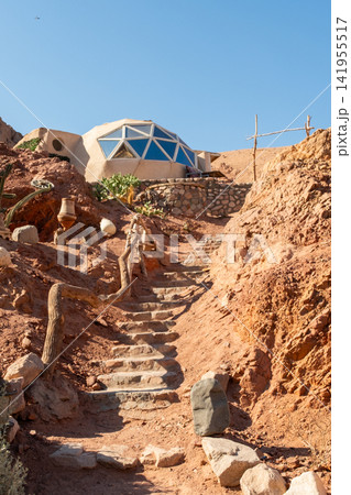 Eco glamping structure in the Sinai mountains, Dahab, Egypt. Unique dome design surrounded by desert landscape and cacti. Focus on eco tourism and camping. Eco glamping structure in the Sinai mountains, Dahab, Egypt. Unique dome design surrounded by desert landscape and cacti. Focus on eco tourism and camping. 141955517