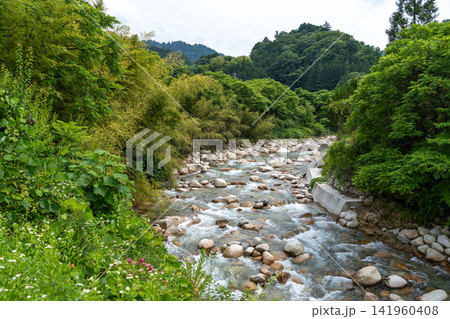 River flowing along the Nakasendo trail between Magome and Tsumago, Japan River flowing along the Nakasendo trail between Magome and Tsumago, Japan 141960408