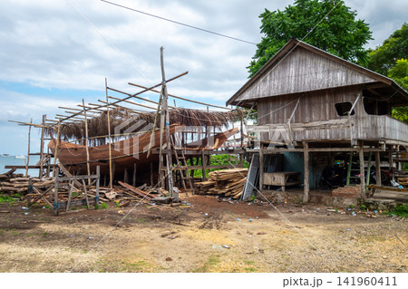 Traditional boat under construction in Tana Beru, Sulawesi, Indonesia Traditional boat under construction in Tana Beru, Sulawesi, Indonesia 141960411